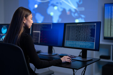 Busy Female IT Consultant in cyber security team working to prevent security threats, vulnerability and solve incidents
