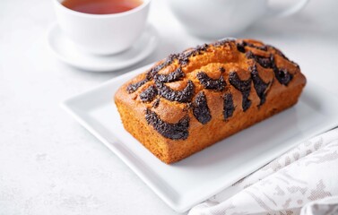 Poppy seed cake with cup of tea