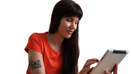 Beautiful, young woman enjoying at home and using her digital tablet	