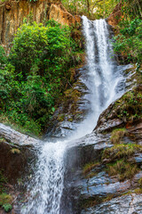 Waterfall in the rainforest with water crashing against rocks in Minas Gerais, Brazil