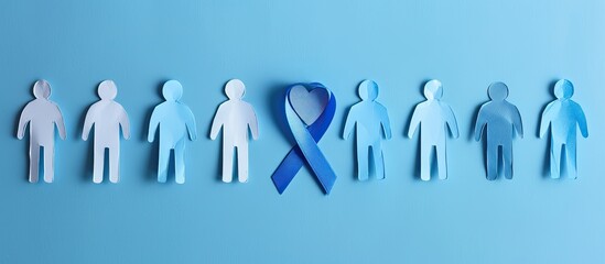 Prostate cancer awareness concept with blue ribbon heart and paper men s silhouettes on a blue background ideal for copy space image