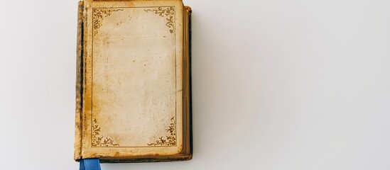 White and gold Bible with blue bookmark on a white background, perfect for adding elements to a copy space image.