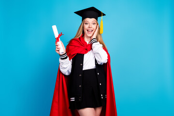 Photo of happy adorable schoolgirl university wear stylish outfit red cape hat isolated on blue color background