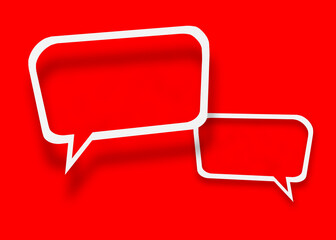 Empty transparent balloon paper speech bubble shape against red background.