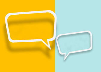 Empty transparent balloon paper speech bubble shape against yellow-light blue background.
