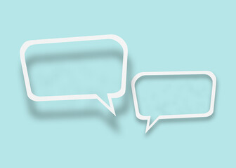 Empty transparent balloon paper speech bubble shape against light blue background.