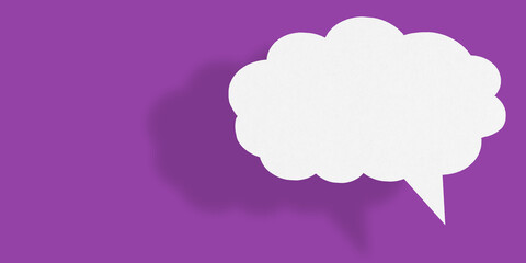 Empty white cloud paper speech bubble shape against purple background.