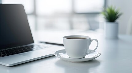 Productive Desk Scene with Laptop, Coffee Cup, and Plant