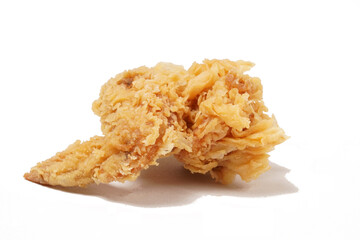 Golden fried chicken with a crispy, flour-coated skin, photographed against a white background.