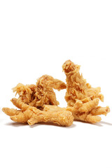 Golden fried chicken with a crispy, flour-coated skin, photographed against a white background.