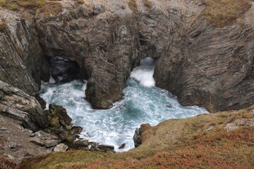 Obraz premium Sea caves and arches at Dungeon Provincial Park near Bonavista, Newfoundland, Canada