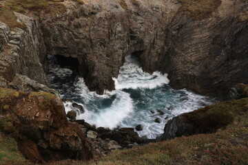 Obraz premium Sea caves and arches at Dungeon Provincial Park near Bonavista, Newfoundland, Canada