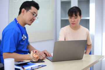 Male doctor with experience examining young pregnant women