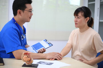 Male doctor with experience examining young pregnant women
