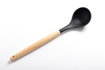 Black silicone kitchen soup ladle isolated on white background. Kitchen utensils