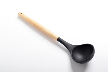 Black silicone kitchen soup ladle isolated on white background. Kitchen utensils