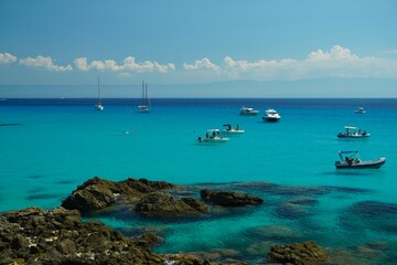 Boats standing or slowly floating along the shore seem to hang in the air, their reflections on the surface of the water create the illusion of flight. The blue of the sea amazes with its purity.