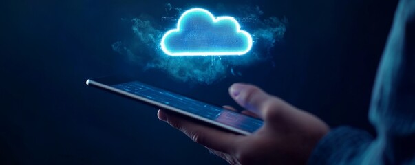 Digital hand holding an iPad with a glowing cloud hologram in a dark background