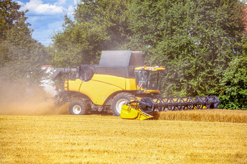 Combine Harvester Cutting Wheat, modern combine harvester working on a wheat crop. combine...