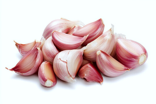 Fresh organic garlic cloves isolated on white background.