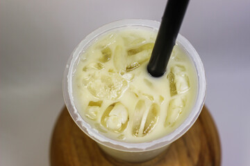 A cup of iced milk on a white background