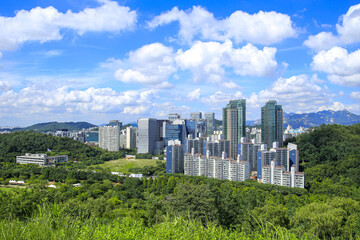 Sangam-dong, Mapo-gu, Seoul, South Korea - July A, 2022: High angle view of high-rise apartments seen from Sky Park against cumulus in the sky