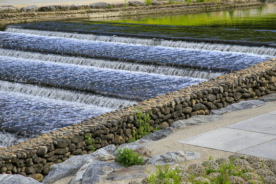 Daechi-dong, Gangnam-gu, Seoul, South Korea - May 26, 2022: Summer view of water stairs for fish way with stone walls at Yangjaecheon Stream 