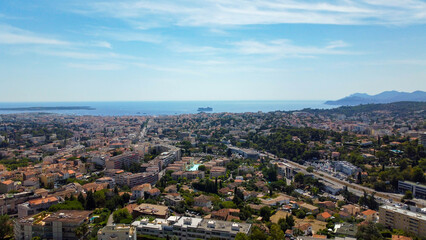 Fototapeta premium View of the coastal city of Cannes on the French Riviera in France. City famous for the film festival. Wonderful coastal city, tourist destination for travel and cruises. Wonders of the Mediterranean