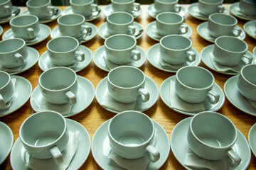 Ceramic cups, arranged neatly, break food
