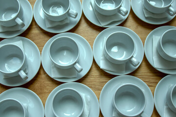 White and gray coffee break cups are arranged neatly.