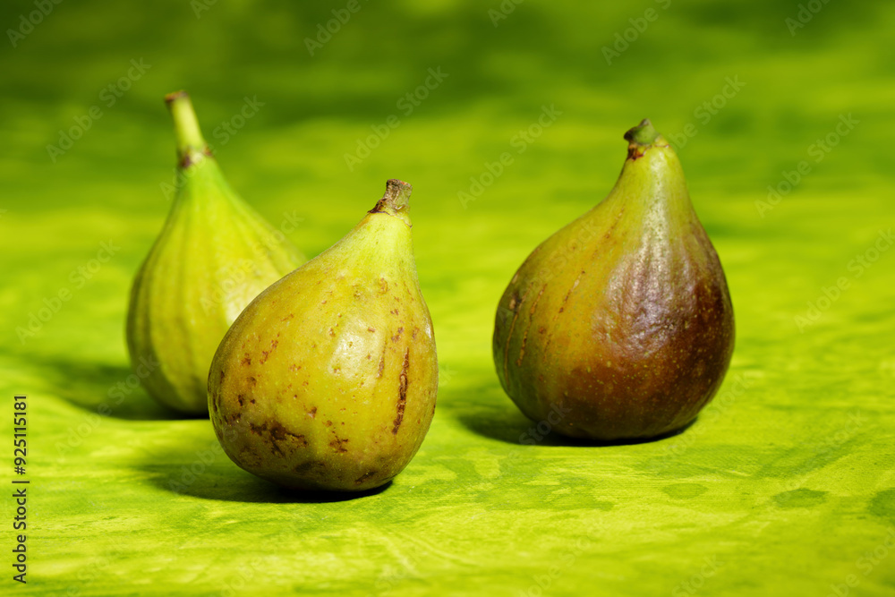 Wall mural fig fruit on green background