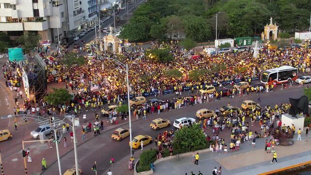 Cinematic view of the people of Colombia Celebration the classification of the World Cup in a national party in the Clock tower in Cartagena