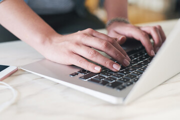 Laptop, hands and person typing email for communication with client for feedback on creative report. Tech, keyboard and public relations manager with fingers on branding technique for small business.