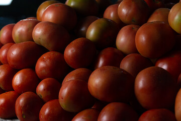 Organic tomatoes stacked with intentional blur effect