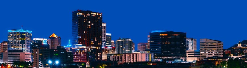 Naklejka premium Salt Lake City Skyline, Skyscrapers, and Buildings in Utah, USA: A tranquil metropolitan modern cityscape of The Crossroads of the West illuminated by lights