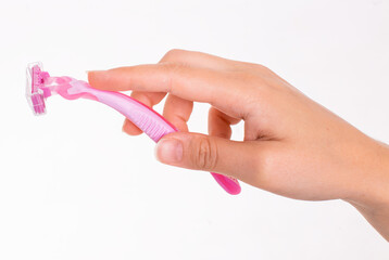 pink razor in female hands isolated on white background