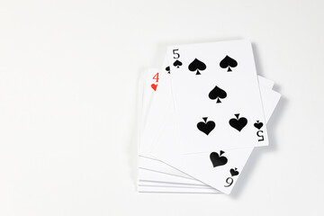 Flying playing card for poker and gambling,  top with 5 spades - isolated on white background.