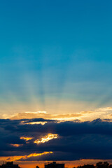 Fototapeta premium Sunrset with dramatic sky. Cloudy sky at sunset. Sky at Sunset Sunrise with real sun and clouds. Real sunset sky, colorful sky during sunset or sunrise, weather, colorful colors of the sky.