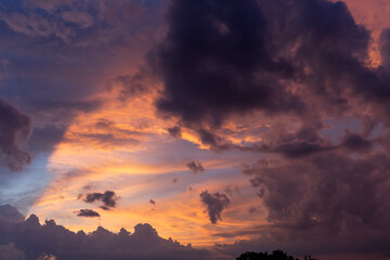 Sunrset with dramatic sky. Cloudy sky at sunset. Sky at Sunset Sunrise with real sun and clouds. Real sunset sky, colorful sky during sunset or sunrise, weather, colorful colors of the sky.