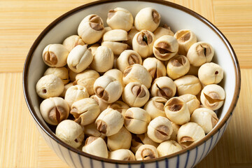 Bowl with dried Lotus seed close up