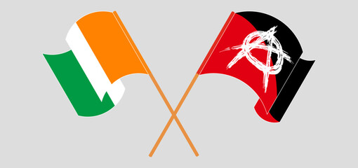 Crossed and waving flags of Ivory Coast and Anarchy