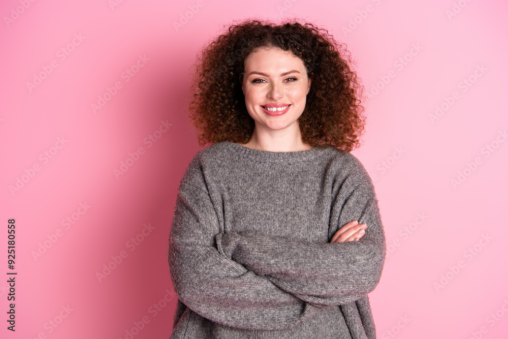 Wall mural Photo portrait of attractive young woman crossed hands confident dressed stylish gray clothes isolated on pink color background