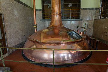 Large copper brewing vessel for beer.
