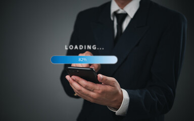 Businessman holding a smartphone with a digital loading progress bar. Ideal for mobile app development,