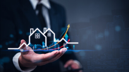 Businessman holding virtual graph showing real estate market growth. Perfect for financial, real estate, and investment presentations. Property market analysis concept.