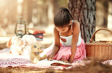 Girl, playing and reading book on picnic at park for story, fantasy and novel for brain...
