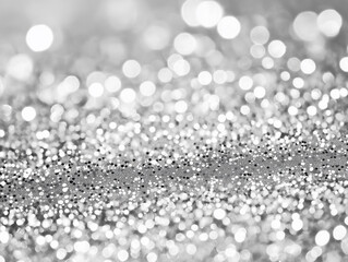 Monochromatic sparkling silver surface with bokeh lights, creating a festive and elegant atmosphere, ideal for celebration or luxury themes.