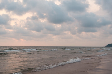 Smooth wave on the beach during sunset in Thailand