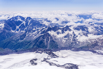 view from the top of the mountain, beautiful mountain landscape with showy peaks