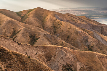 Clayey arid mountain canyon. Mountain landscapes of Kyrgyzstan.